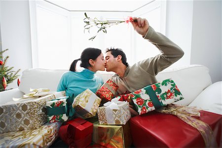 sitting on lap facing each other - Couple Under Mistletoe Stock Photo - Rights-Managed, Code: 700-00560544