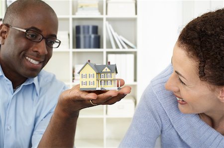 Couple Looking at Toy House Stock Photo - Rights-Managed, Code: 700-00560896