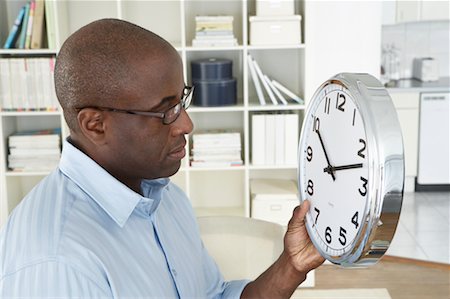 Man Holding Clock Stock Photo - Rights-Managed, Code: 700-00560901