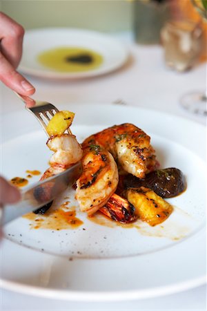 Man Eating Shrimp Stock Photo - Rights-Managed, Code: 700-00561320