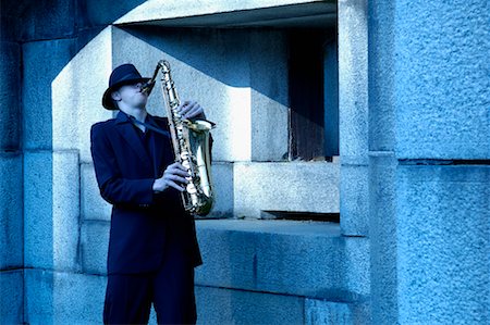 saxophone on building - Man Playing Saxophone Stock Photo - Rights-Managed, Code: 700-00561772