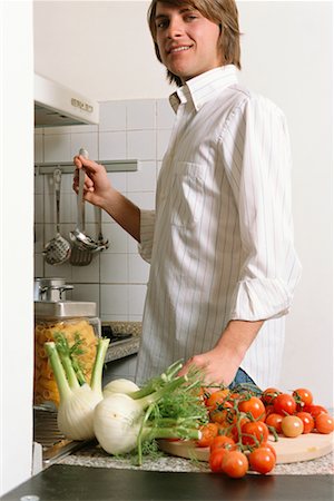 Young Man Cooking Stock Photo - Rights-Managed, Code: 700-00561810