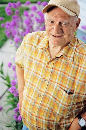 Man Standing Beside Flower Garden Stock Photo - Rights-Managed, Code: 700-00562297