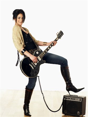 star (famous, female) - Woman Playing Electric Guitar Stock Photo - Rights-Managed, Code: 700-00562327