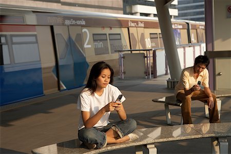 People Using Cellular Telephones, Bangkok, Thailand Stock Photo - Rights-Managed, Code: 700-00588988