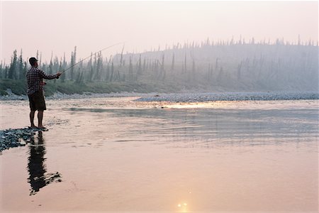 Fishing on  the Firth River, Firth River Valley, Yukon, Canada Stock Photo - Rights-Managed, Code: 700-00591927