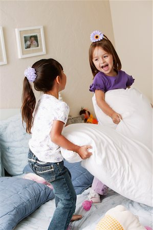 Girls Having a Pillow Fight Stock Photo - Rights-Managed, Code: 700-00591984