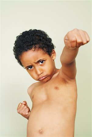 defensive posture - Boy Punching Foto de stock - Con derechos protegidos, Código: 700-00592338