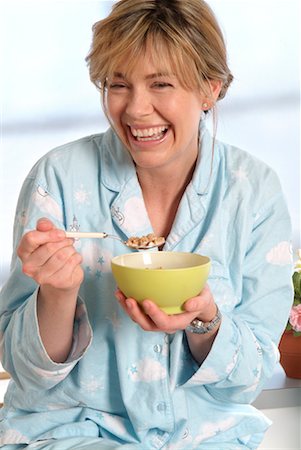 Woman Eating Cereal Foto de stock - Con derechos protegidos, Código: 700-00592523