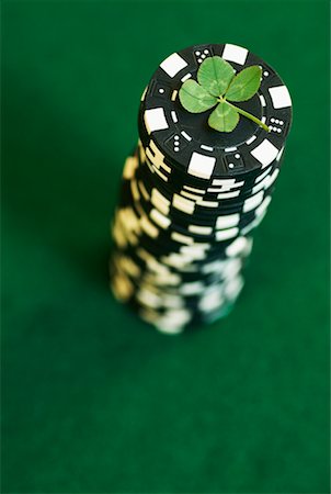 simsearch:600-00367745,k - Four-Leaf Clover On Stack of Poker Chips Stock Photo - Rights-Managed, Code: 700-00592805