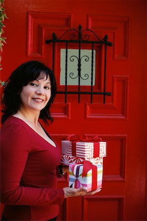 Woman at Door with Gifts Stock Photo - Rights-Managed, Code: 700-00593008