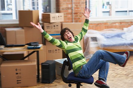 Man Goofing Around on Chair Stock Photo - Rights-Managed, Code: 700-00604484