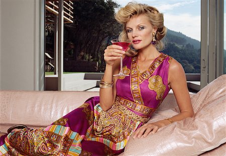 simsearch:700-01788191,k - Portrait of Woman Lounging And Drinking A Cocktail Stock Photo - Rights-Managed, Code: 700-00606407
