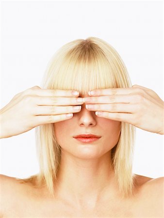 Femme couvrant yeux avec les mains Photographie de stock - Rights-Managed, Code: 700-00606446
