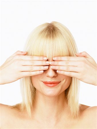 Femme couvrant yeux avec les mains Photographie de stock - Rights-Managed, Code: 700-00606447