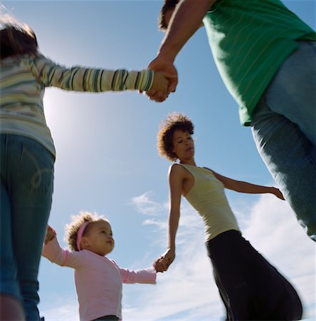 picture of white and black people holding hands - Family Playing Outdoors Stock Photo - Rights-Managed, Code: 700-00606690