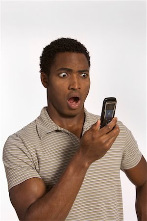 Man Reading Text Message, Looking Shocked Stock Photo - Rights-Managed, Code: 700-00607095