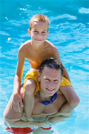 shoulder ride in swimming pool - Father and Son in Pool Stock Photo - Rights-Managed, Code: 700-00607509