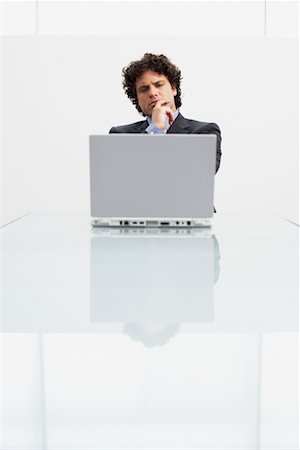Homme d'affaires utilisant un ordinateur portable Photographie de stock - Rights-Managed, Code: 700-00607803
