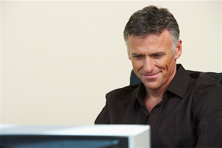 Man Looking at Computer Stock Photo - Rights-Managed, Code: 700-00608457