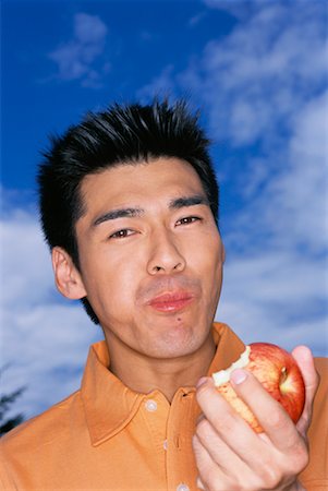 Portrait of Man Eating Apple Stock Photo - Rights-Managed, Code: 700-00608732