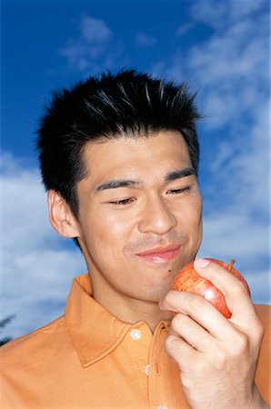 Portrait of Man Eating Apple Foto de stock - Con derechos protegidos, Código: 700-00608733