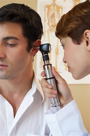 doctor checking ear - Patient and Doctor Stock Photo - Rights-Managed, Code: 700-00609558