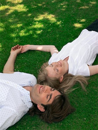 simsearch:700-00611221,k - Couple Lying on Grass Stock Photo - Rights-Managed, Code: 700-00609890