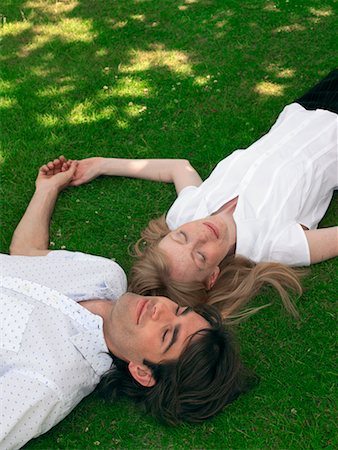 simsearch:700-00611221,k - Couple Lying on Grass Stock Photo - Rights-Managed, Code: 700-00609891