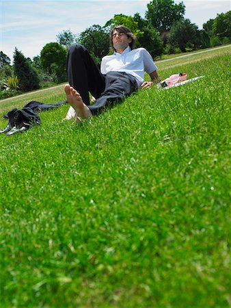 simsearch:700-00611221,k - Man Sitting on Grass Stock Photo - Rights-Managed, Code: 700-00609893