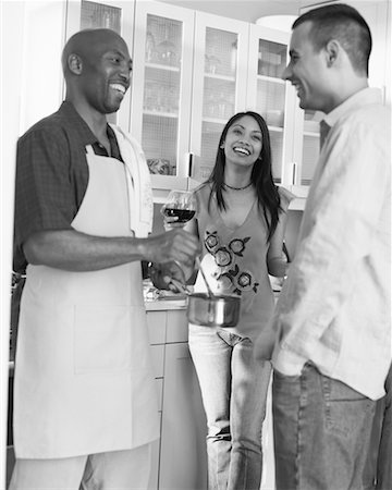 social gathering black and white picture - People Talking and Cooking In The Kitchen Stock Photo - Rights-Managed, Code: 700-00609989