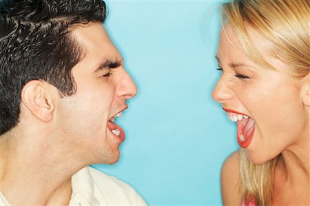 Close-Up Portrait of Man and Woman Screaming at Each Other Stock Photo - Rights-Managed, Code: 700-00603461