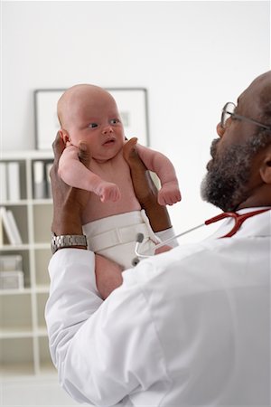 picture of a black a newborn baby girl - Doctor Holding Newborn Baby Stock Photo - Rights-Managed, Code: 700-00616603