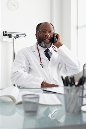 Doctor Talking on Phone in Office Stock Photo - Rights-Managed, Code: 700-00616616