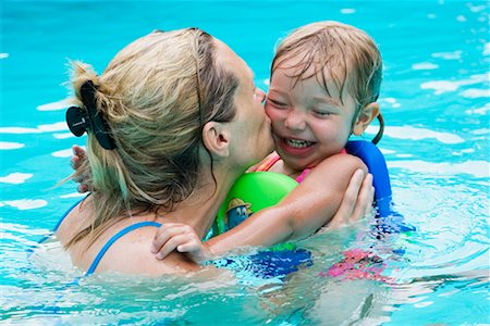 simsearch:700-02786761,k - Mother and Daughter Playing In Swimming Pool Stock Photo - Rights-Managed, Code: 700-00616878