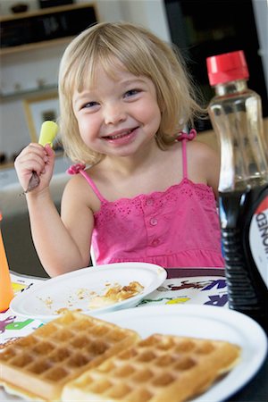 simsearch:700-00478241,k - Girl Eating Breakfast Foto de stock - Con derechos protegidos, Código: 700-00616904