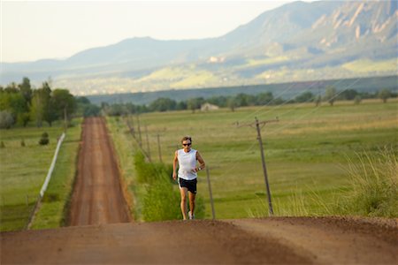 Man Running on Country Road, Colorado, USA Stock Photo - Rights-Managed, Code: 700-00617119