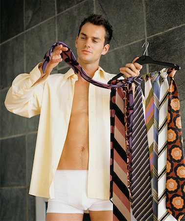 simsearch:640-03263901,k - Man Choosing Necktie Fotografie stock - Rights-Managed, Codice: 700-00617379