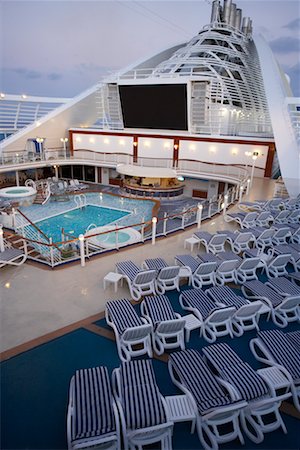 deck chair swimming pool nobody - Cruise Ship Deck With Lounge Chairs, Swimming Pool, and Movie Screen Stock Photo - Rights-Managed, Code: 700-00617415