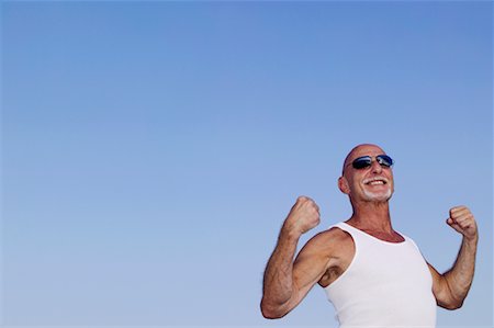 sunglasses for bald men - Portrait of Man Flexing Muscles Stock Photo - Rights-Managed, Code: 700-00618192