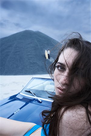 Portrait of Woman Sitting on Hood of Car Stock Photo - Rights-Managed, Code: 700-00618492