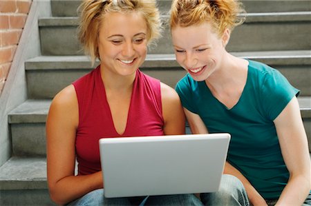 Women With Laptop Computer Sitting on Stairs Stock Photo - Rights-Managed, Code: 700-00618586