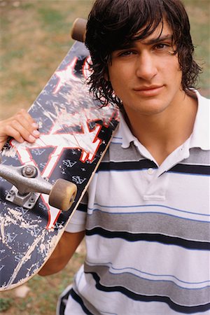 Portrait of Man with Skateboard Foto de stock - Con derechos protegidos, Código: 700-00618687