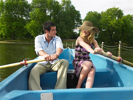 Man and Woman Paddling Rowboat Together Stock Photo - Rights-Managed, Code: 700-00610083