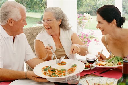 picture of family celebration meal in a dinner party - Family Eating in Backyard Stock Photo - Rights-Managed, Code: 700-00610204