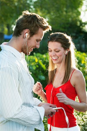 Couple Listening to MP3 Player Stock Photo - Rights-Managed, Code: 700-00610489