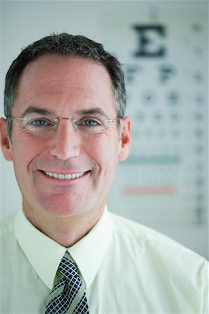eye doctor test - Portrait of Man with Eye Chart Stock Photo - Rights-Managed, Code: 700-00610957