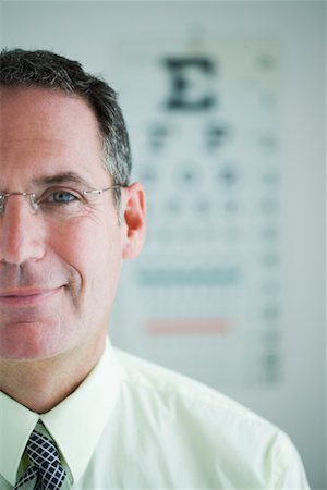 eye doctor test - Portrait of Man with Eye Chart Stock Photo - Rights-Managed, Code: 700-00610958
