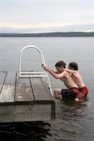 Two Brothers Climbing From Lake Rosseau, Muskoka, Ontario, Canada Stock Photo - Rights-Managed, Code: 700-00611106