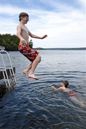 Two Brothers Swimming, Lake Rosseau, Muskoka, Ontario, Canada Stock Photo - Rights-Managed, Code: 700-00611103